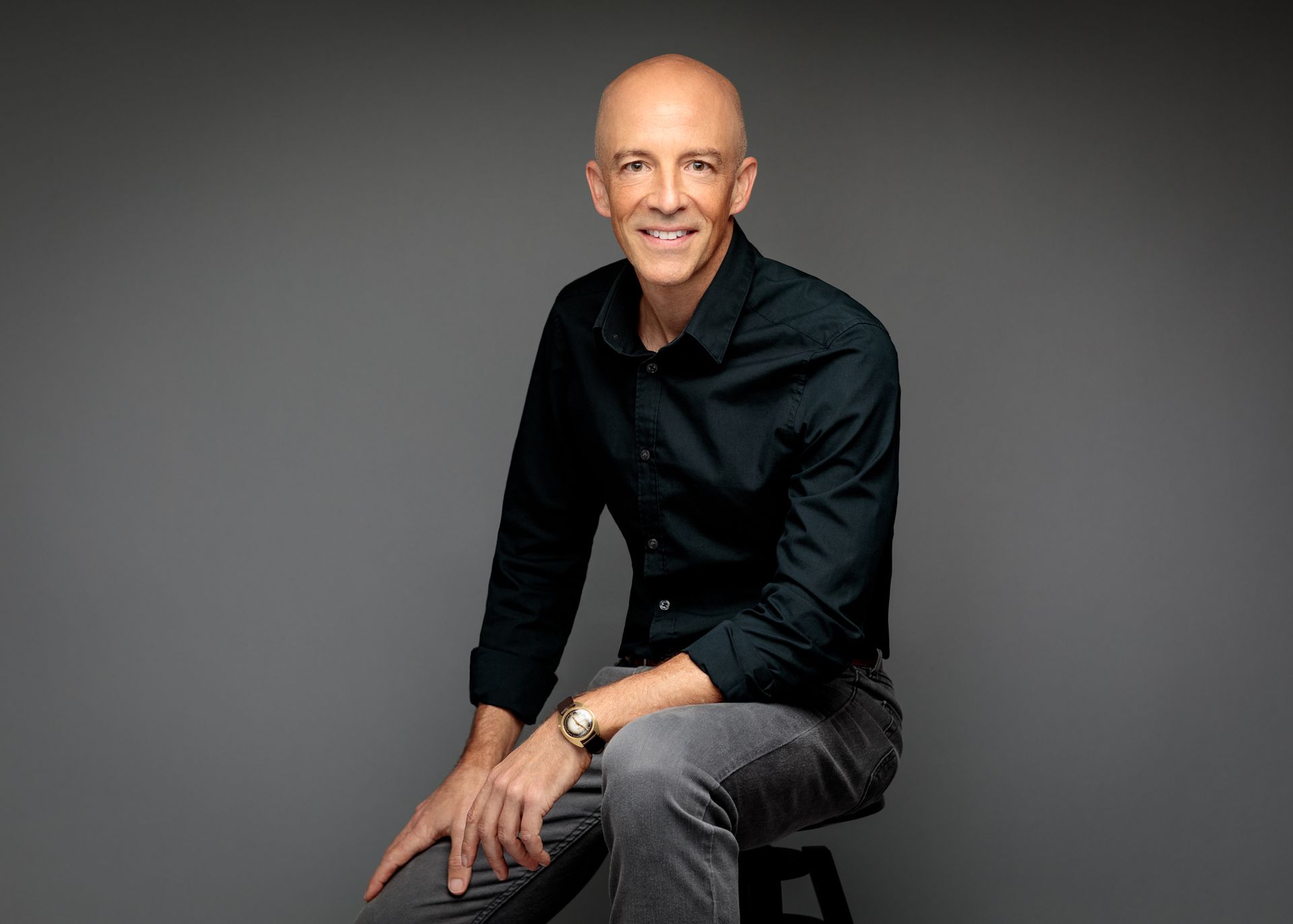 Photo of Michael Ceely sitting down, smiling