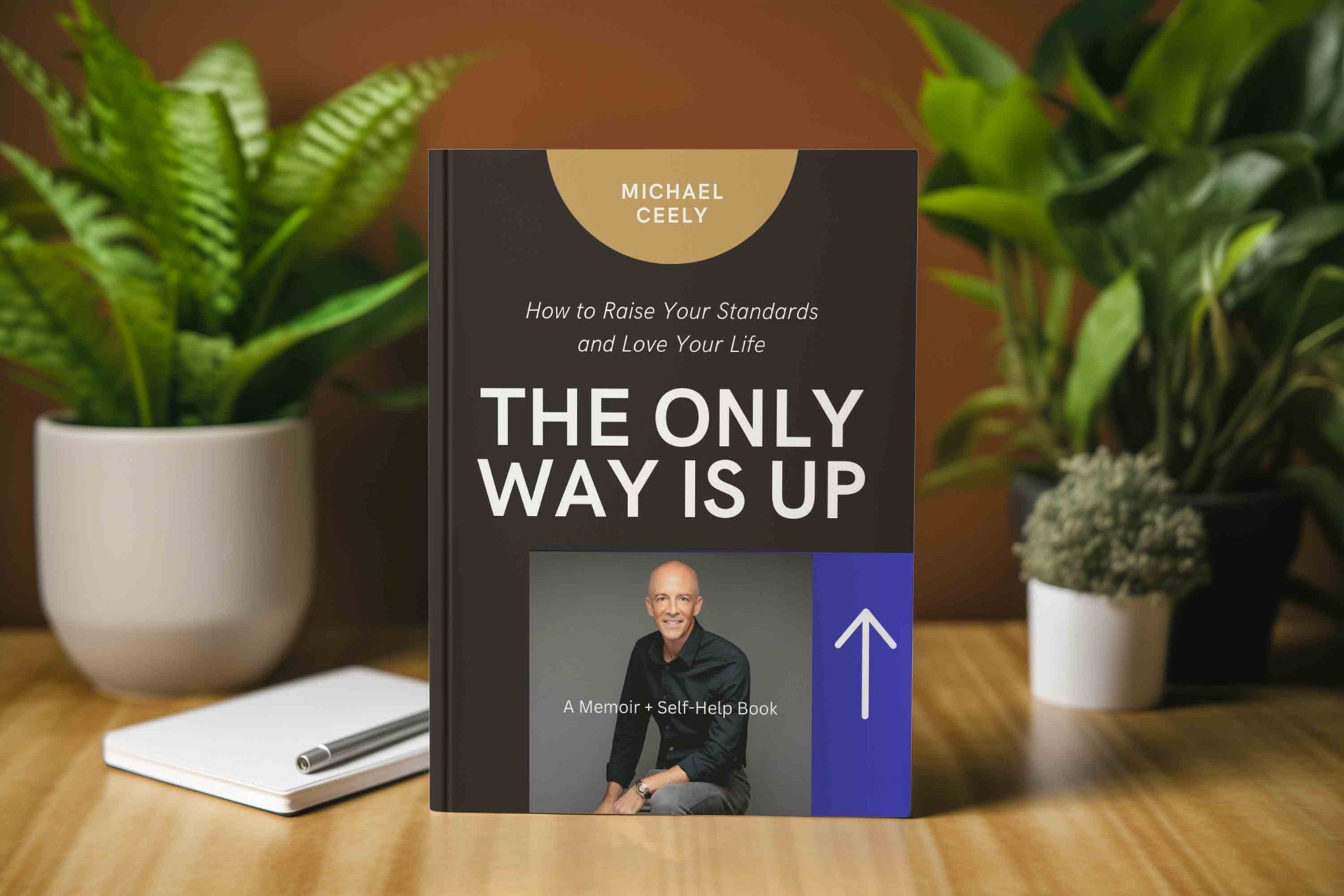 A book titled The Only Way is Up is sitting on a wooden table.