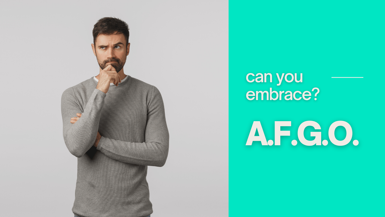 A man with a beard is standing with his arms crossed and his hand on his chin.