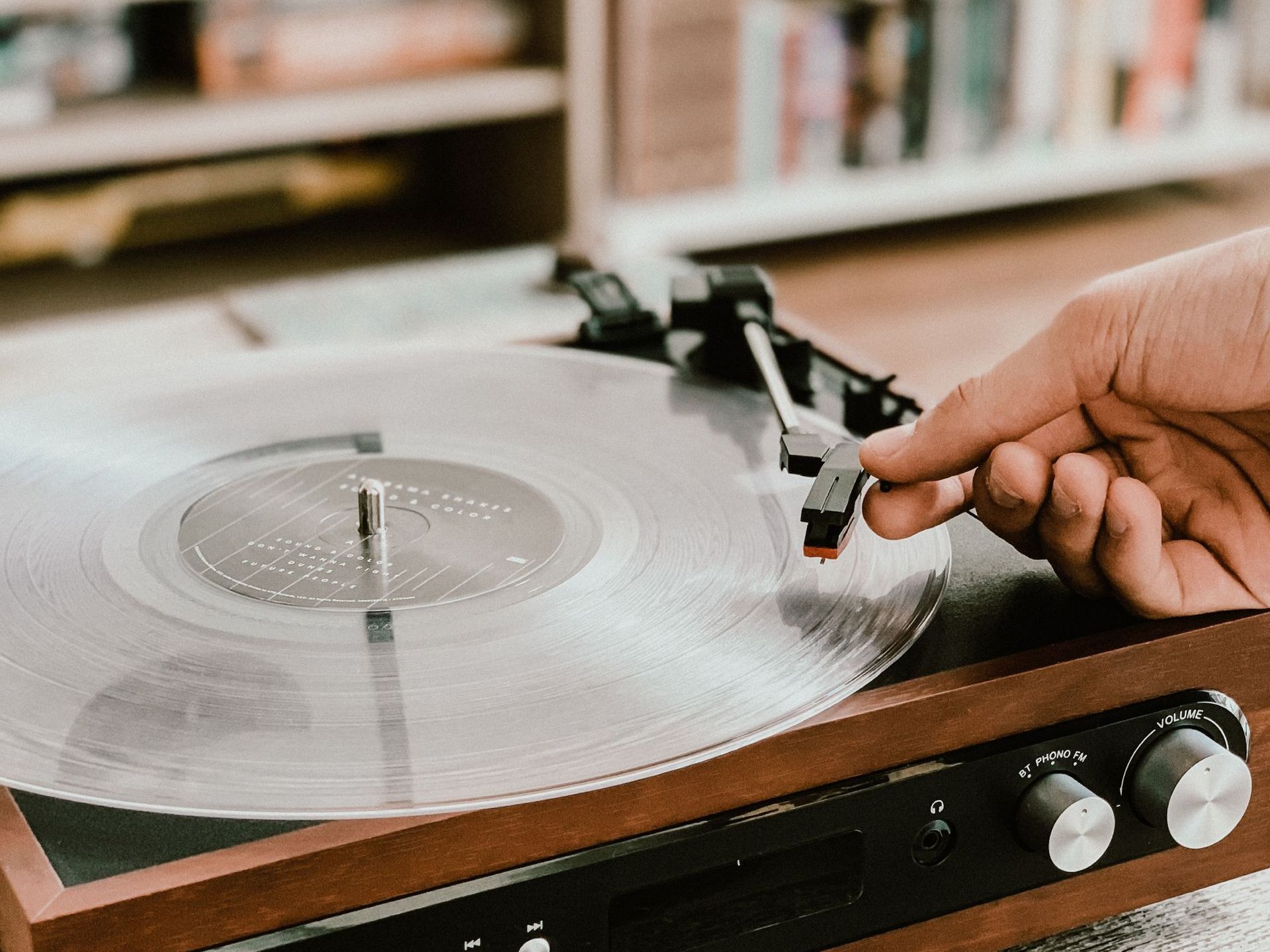 person playing a record player
