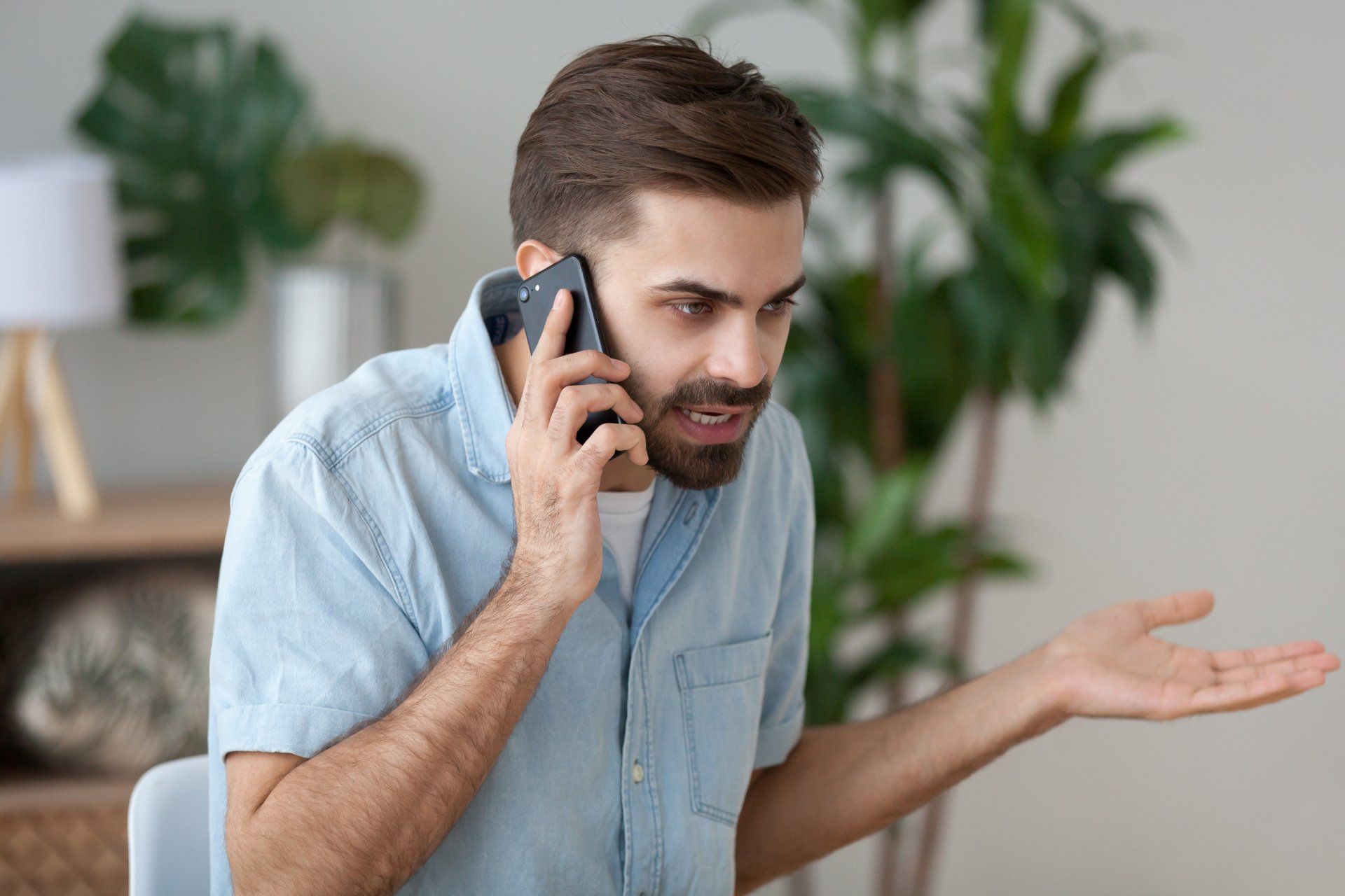A man is talking on a cell phone.