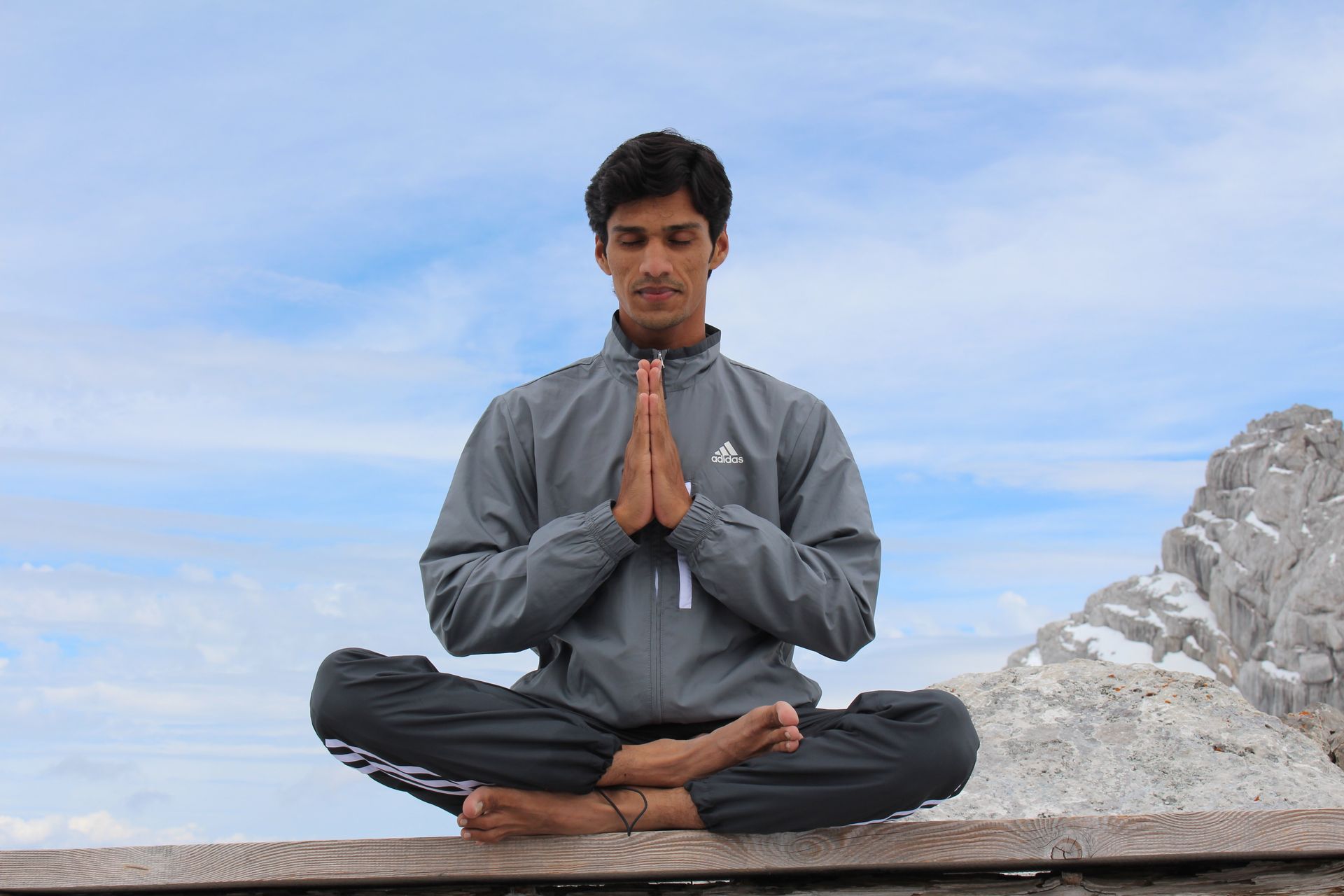 Young man sitting in the lotus position