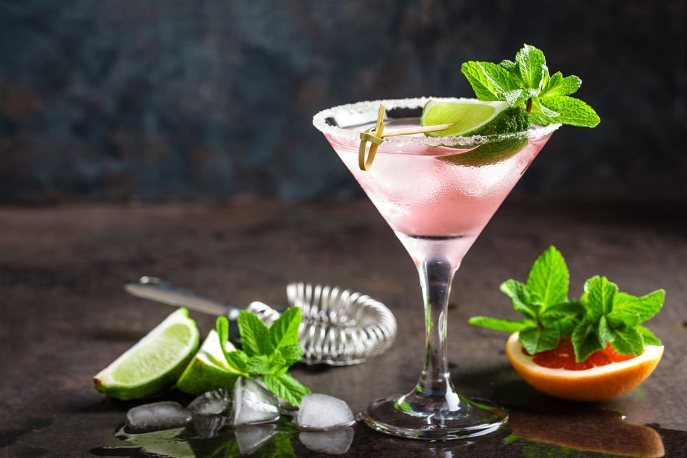 A Pink Martini With Ice and Mint Leaves on a Wooden Table — Mumbo's Pizza'n'Pasta In Lismore, NSW