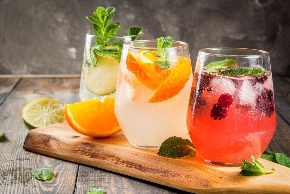 Three Different Types of Drinks Are Sitting on a Wooden Cutting Board — Mumbo's Pizza'n'Pasta In Lismore, NSW