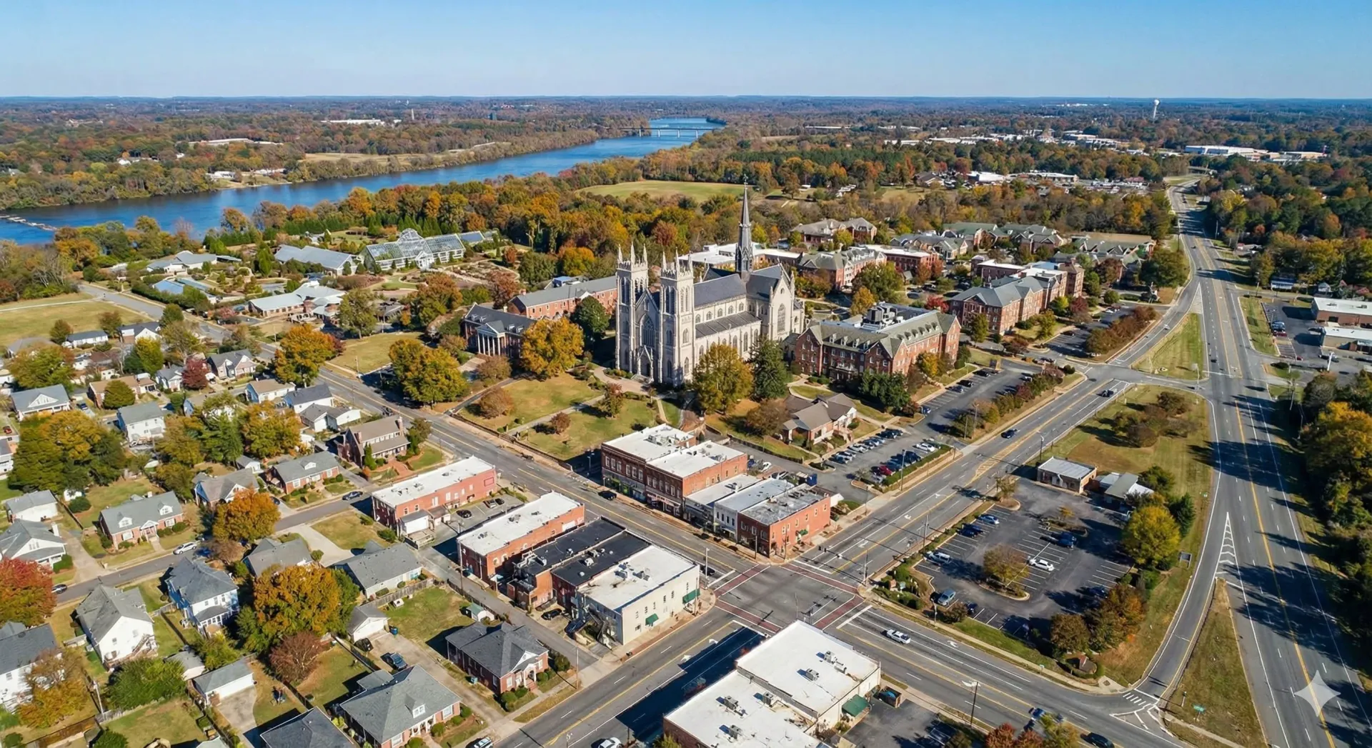 An aerial view of a city with a lake in the background.