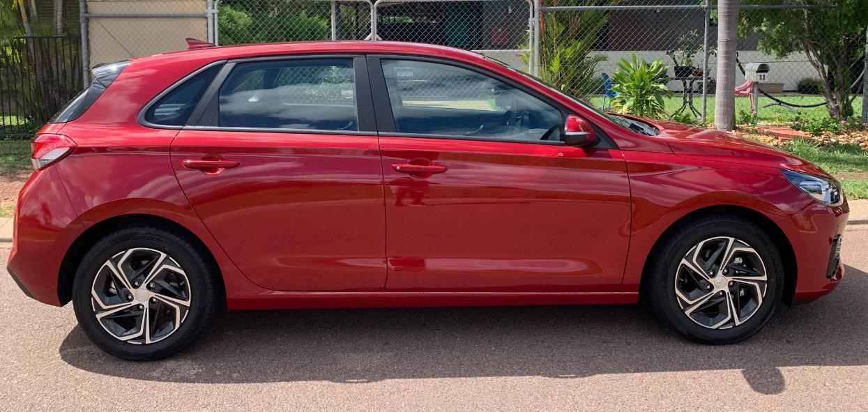 A Red Car Is Parked On The Road โ Primera Driving School Darwin In Anula, NT