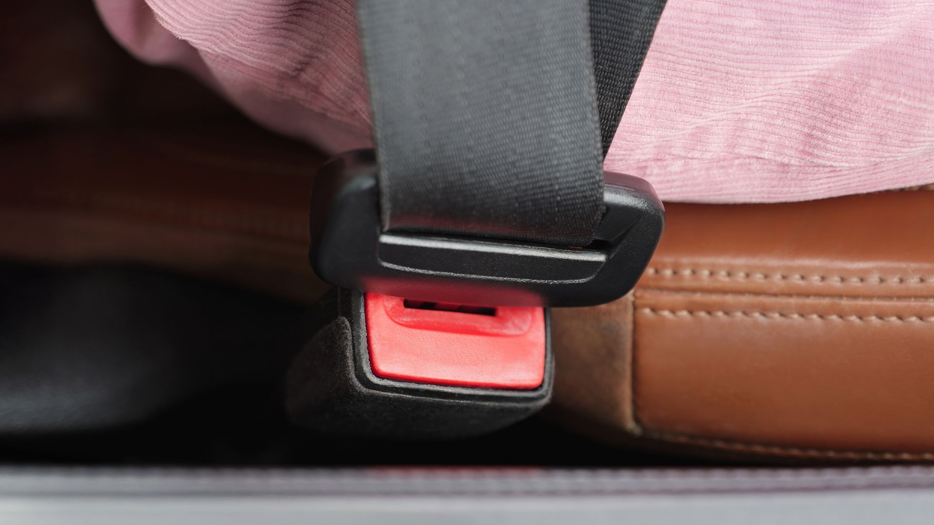 Close-up of fastened seatbelt on luxury car seat. Close-up of fastened seatbelt on luxury car seat.