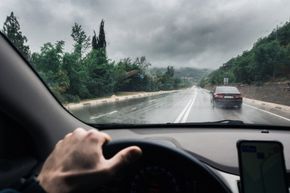 View Through the Windshield on a Wet Highway in the Rain — Central Islip, NY — Defensive Driving School View Through the Windshield on a Wet Highway in the Rain — Central Islip, NY — Defensive Driving School