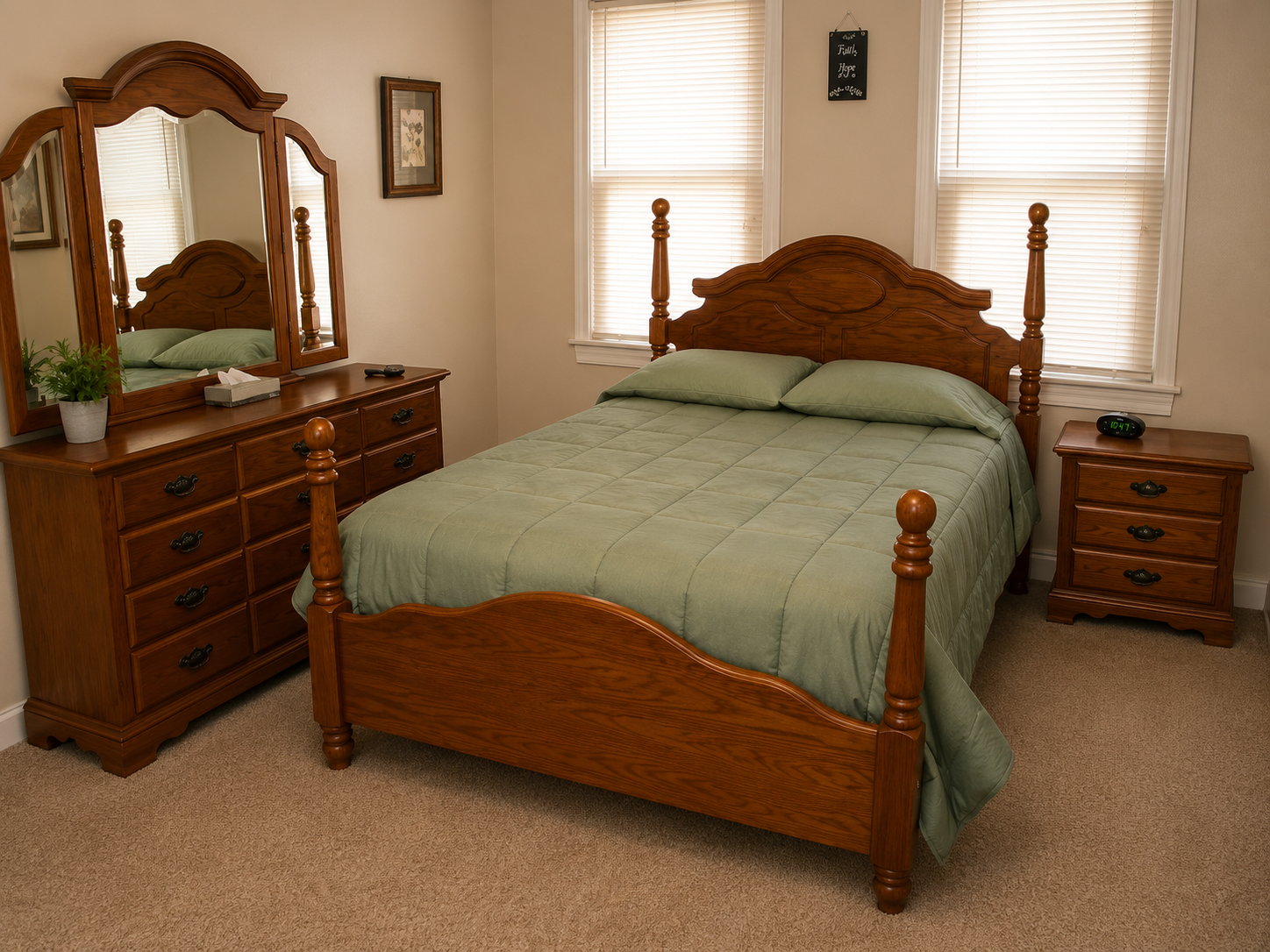 Bedroom with a wooden bed, dresser, mirror, and two windows with blinds
