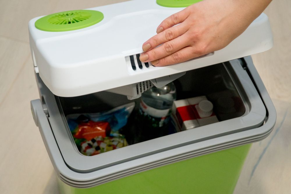 A Green And White Cooler Filled With Food And Drinks — South Coast Refrigeration & Air Conditioning In Bomaderry, NSW