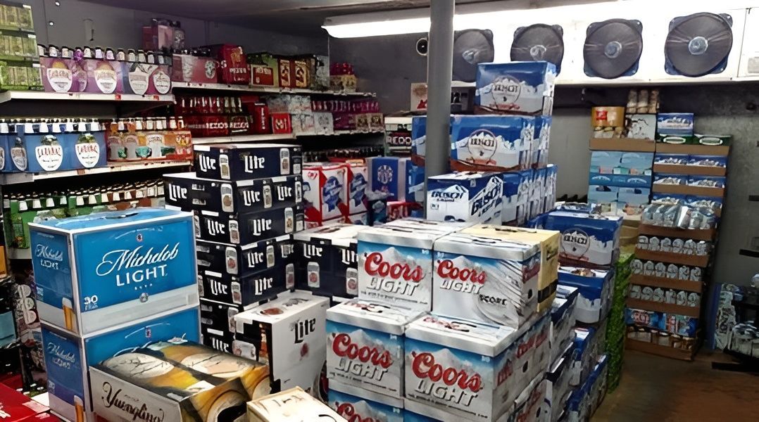 A Store Filled With Lots Of Boxes Of Beer — South Coast Refrigeration & Air Conditioning In Bomaderry, NSW