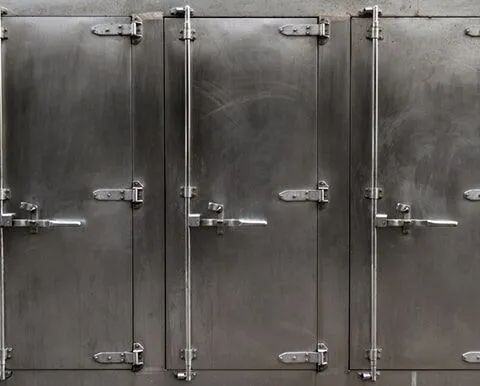 A Close Up Of A Row Of Stainless Steel Doors — South Coast Refrigeration & Air Conditioning In Bomaderry, NSW