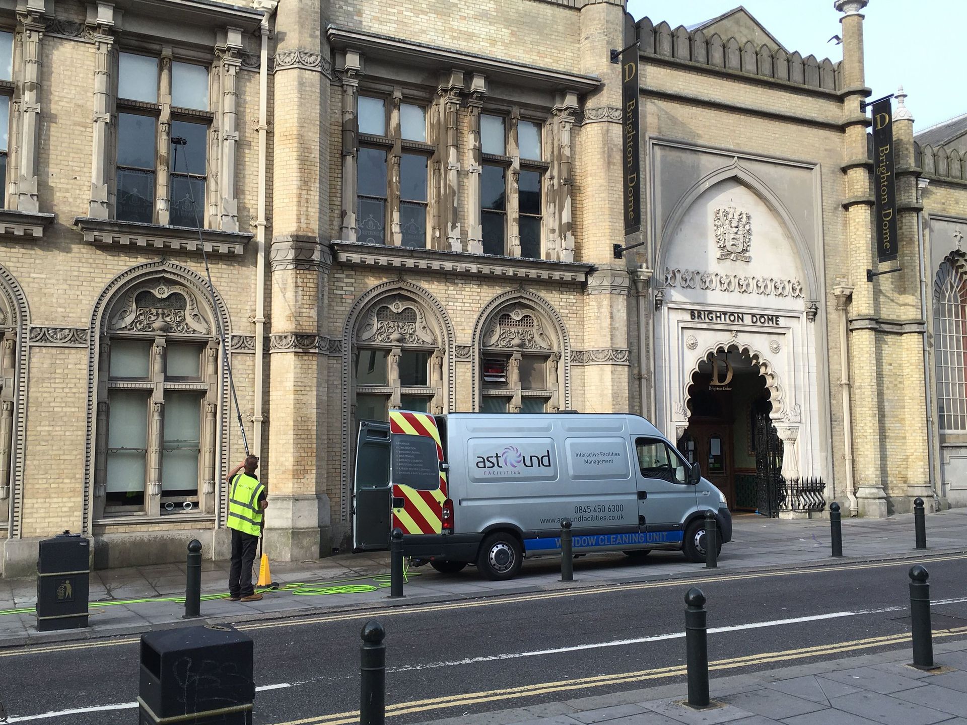Best ways to clean windows outside — professional window cleaners using water fed poles at Brighton Dome