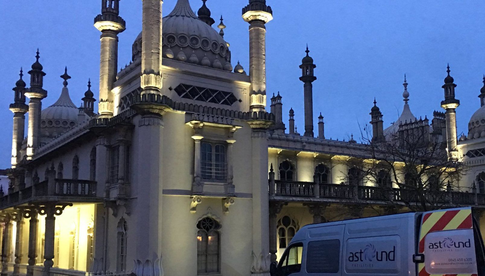 Heritage building cleaning at Brighton Pavilion at dusk, with the Astound service van in the foreground.