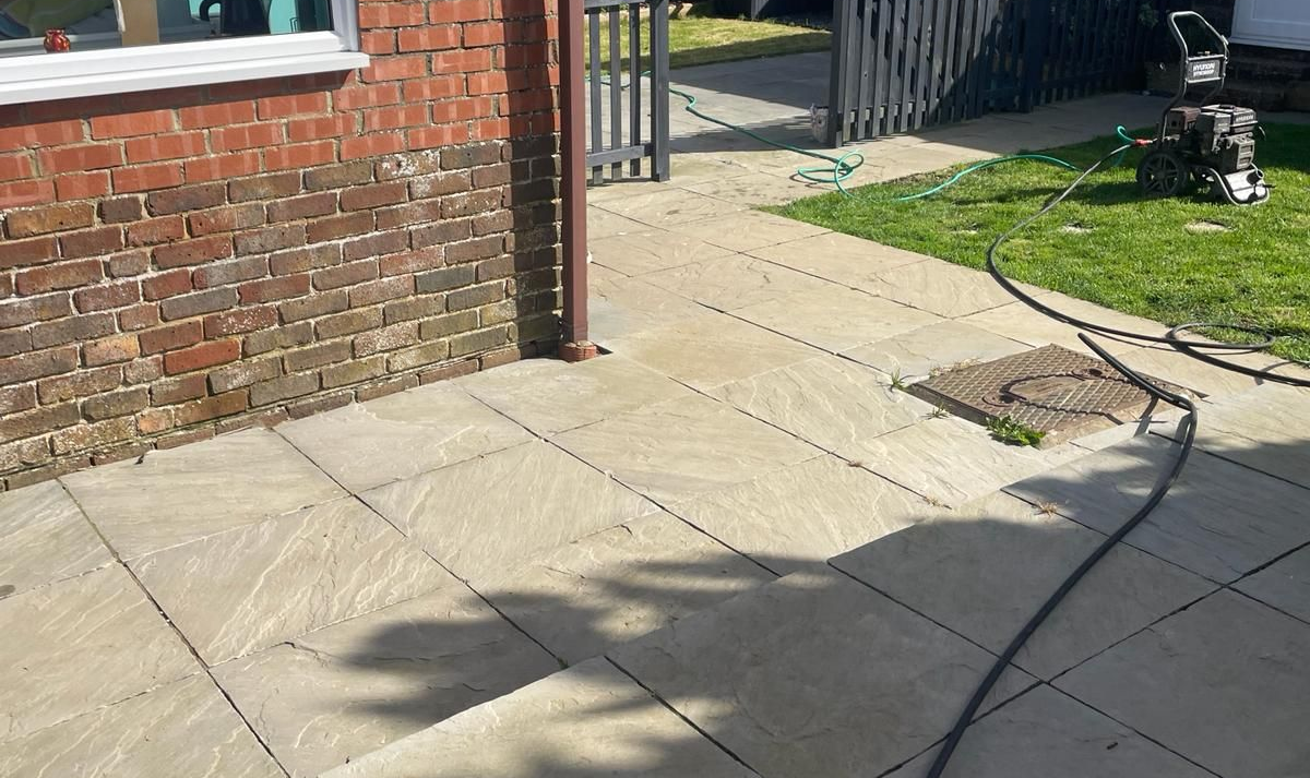 Astound Cleaning Group pressure washing a block-paving driveway — professional residential driveway and patio cleaning in Sussex & South London