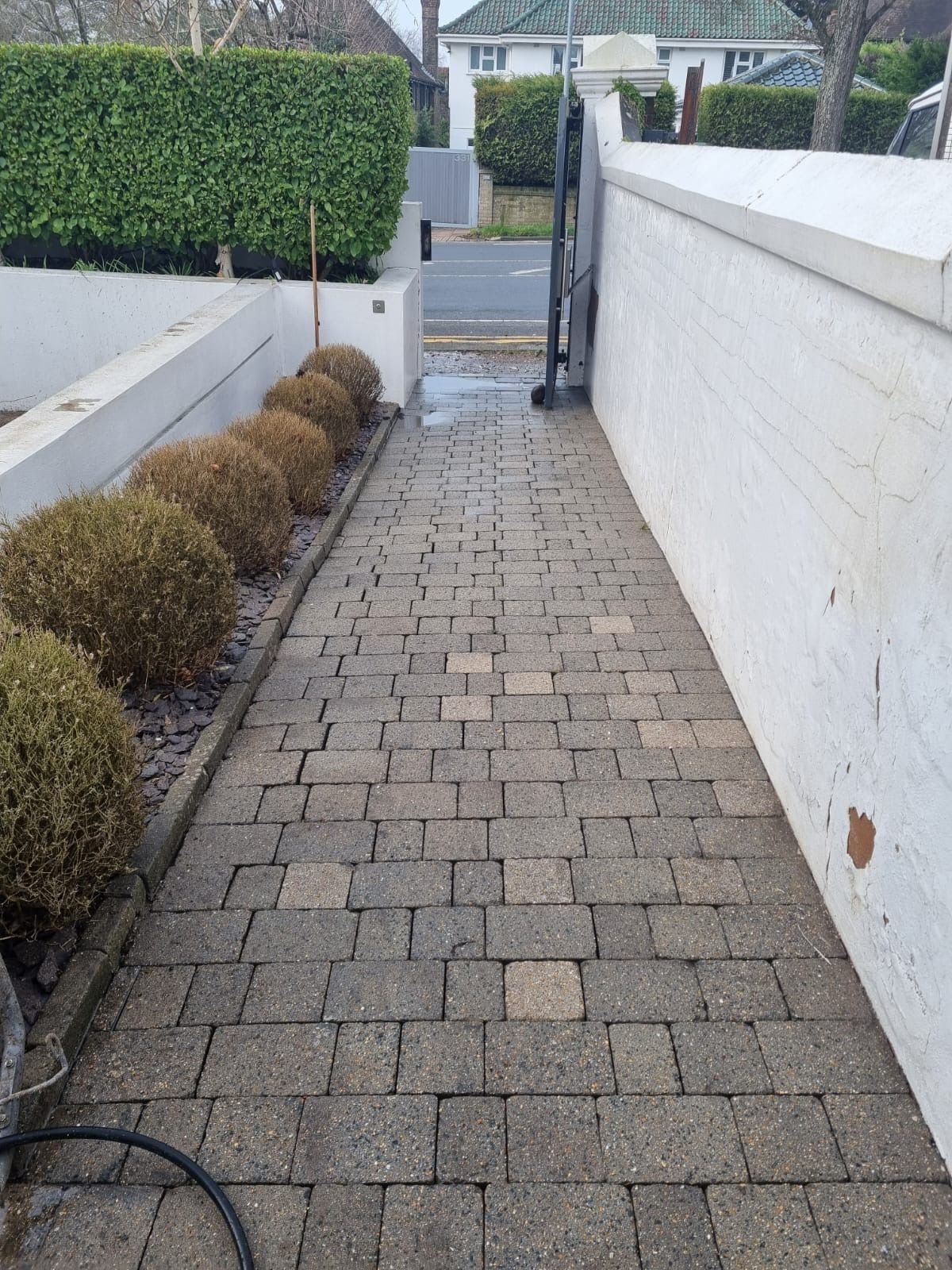 After — residential pressure washing complete, restored block paving driveway at a Sussex home by Astound Cleaning Group