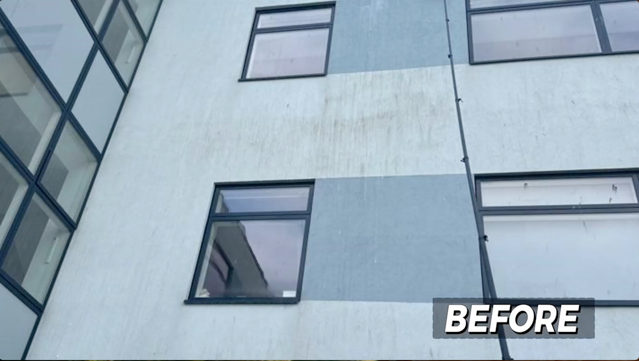 Exterior building wall, light and dark blue paint with windows, 