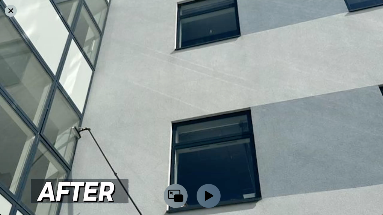 White building exterior with clean windows; 