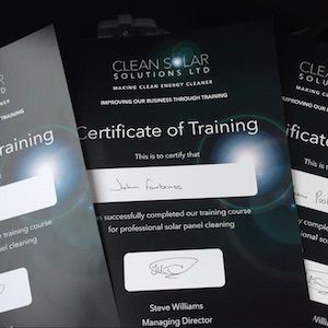 Certificates of training for solar panel cleaning. One signed by John Forbes, another by Steve Williams.