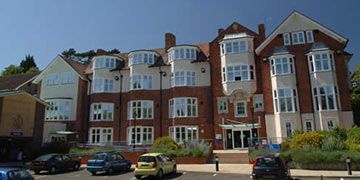Period brick buildings on the University of Brighton Eastbourne campus where Astound provides window