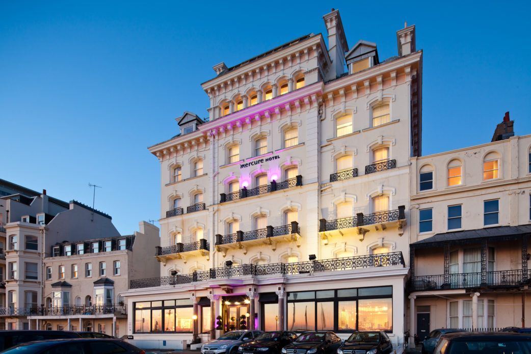 Mercure Brighton Seafront Hotel facade at dusk showing the Grade II listed Victorian building where 