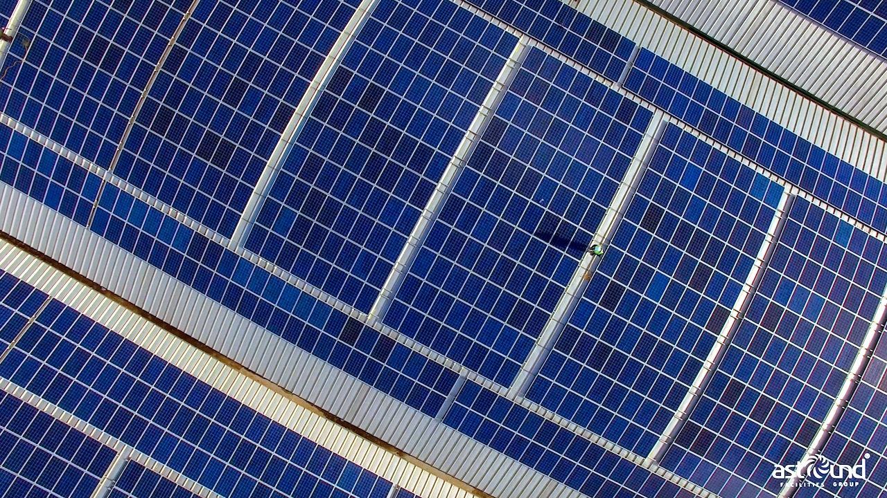 Close-up of blue solar panels in a grid pattern, generating clean energy from sunlight.