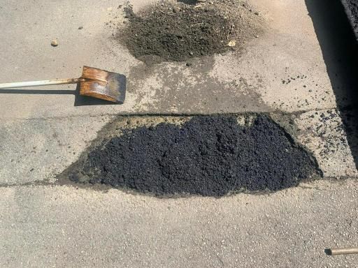 Shovel is Laying on the Ground Next to a Patch of Asphalt — JP Civilworx Pty Ltd in Cessnock, NSW