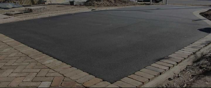 Large Piece of Asphalt is Sitting on Top of a Brick Driveway — JP Civilworx Pty Ltd in Mid North Coast, NSW