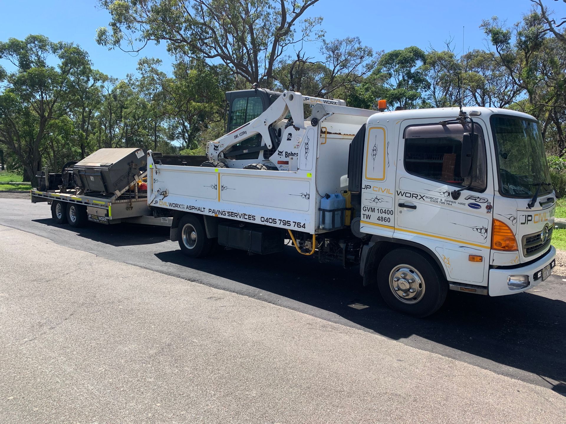 A Bobcat Tractor In The Back Of A Construction Vehicle — JP Civilworx Pty Ltd in Eraring, NSW