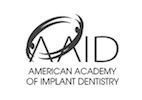 The american academy of implant dentistry logo is black and white.