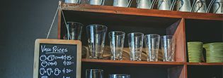 Shelf With Glasses — Florists In Woolgoolga, NSW
