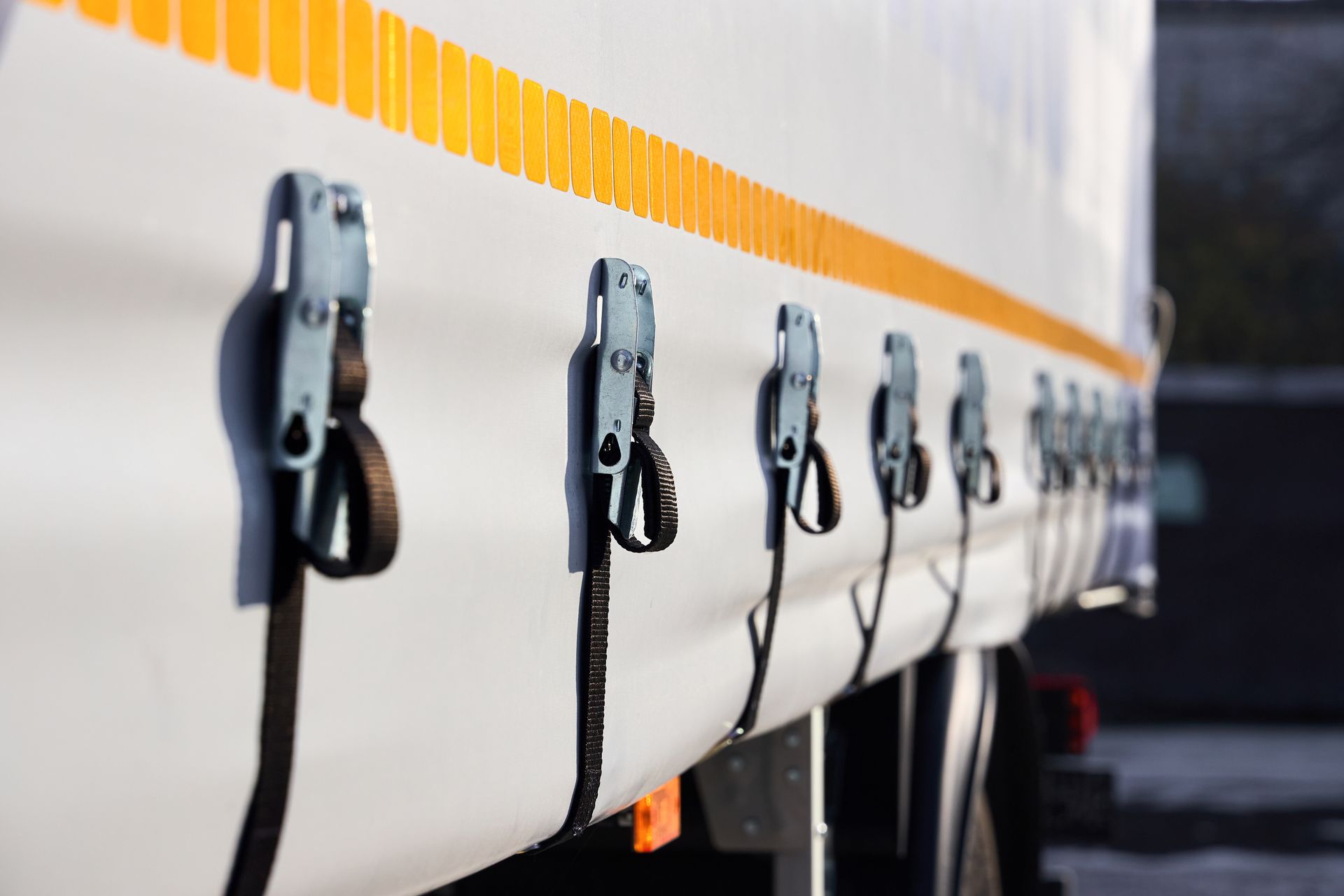 Truck or trailer curtain side system tensioning buckles and straps. Truck or trailer curtain side system tensioning buckles and straps.