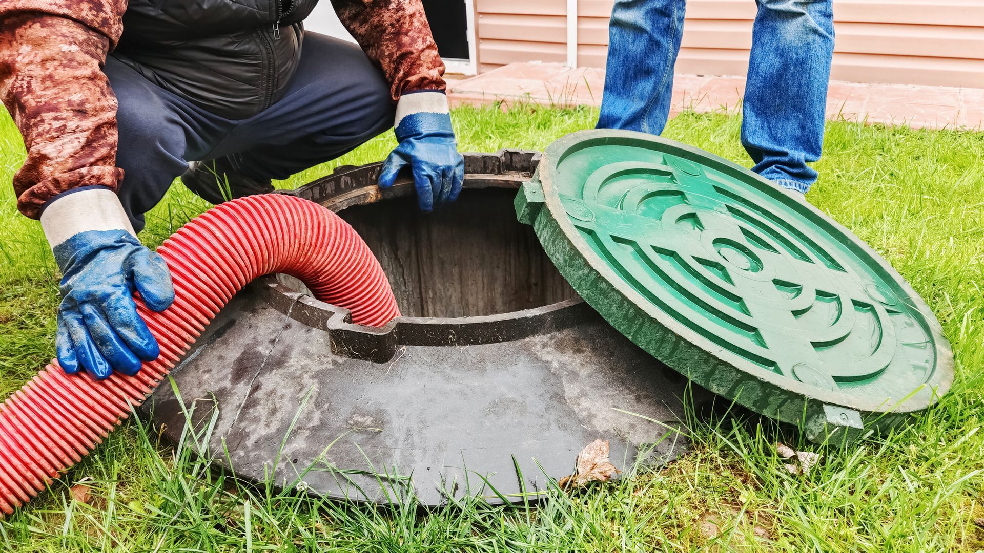 Plumbing professionals performing a residential sewer inspection in New Rochelle, NY.