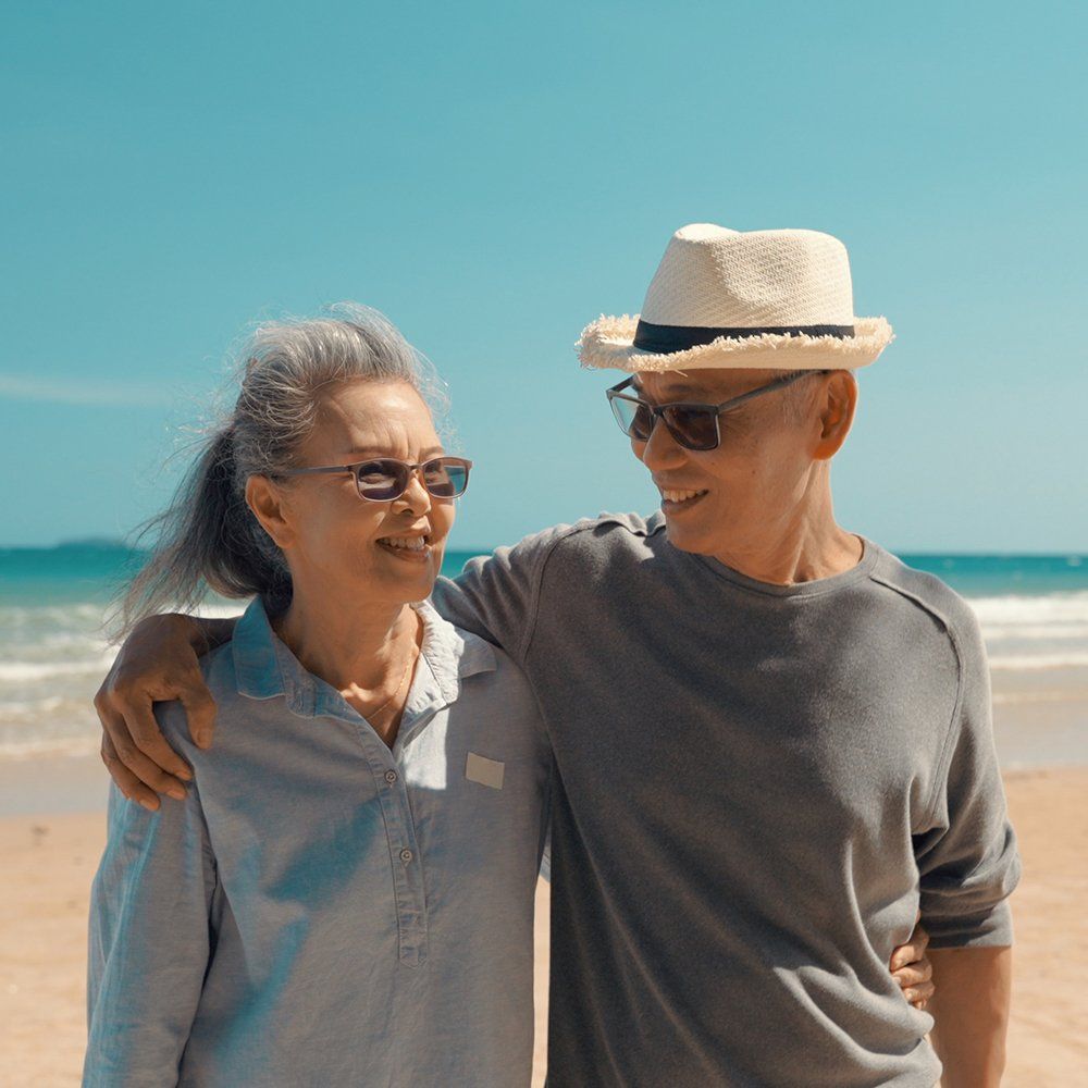 Senior Couple At The Beach — Lake Worth, FL — Mercer Law Immigration Attorneys Senior Couple At The Beach — Lake Worth, FL — Mercer Law Immigration Attorneys