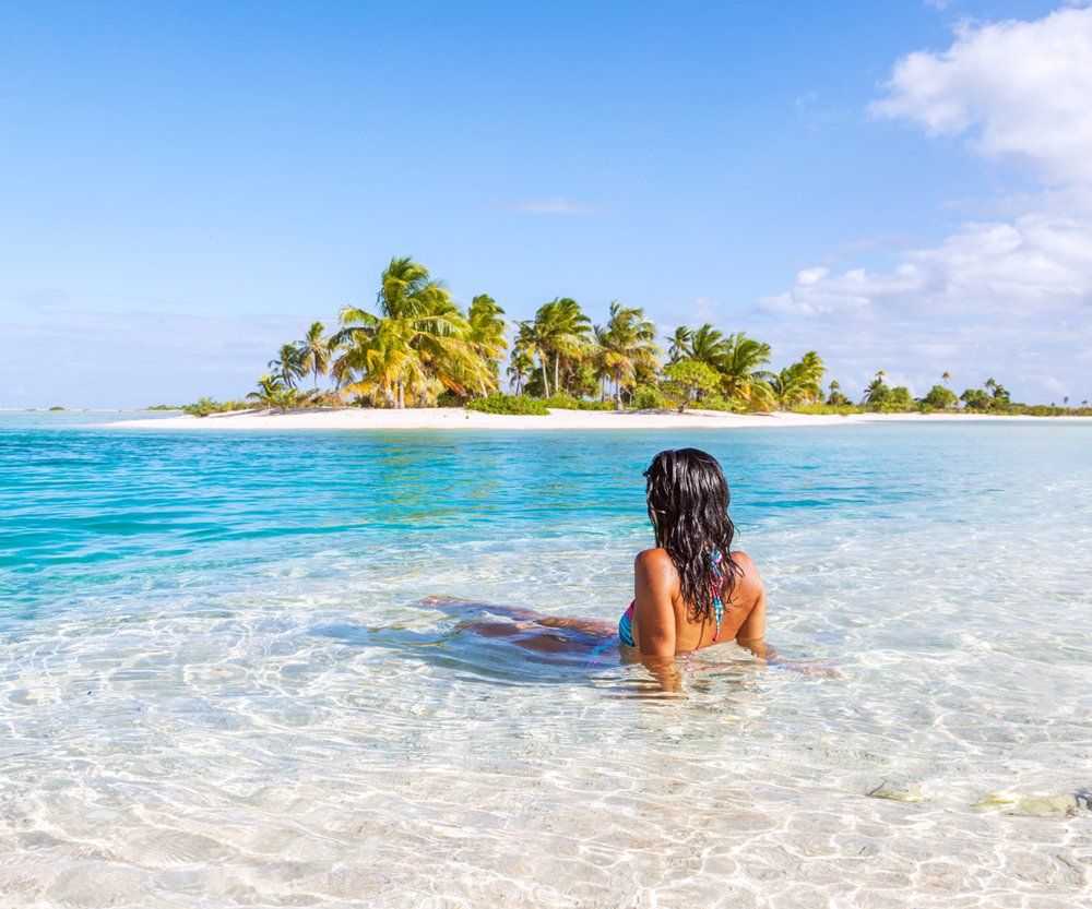 Woman Sitting In The Blue Lagoon — Lake Worth, FL — Mercer Law Immigration Attorneys