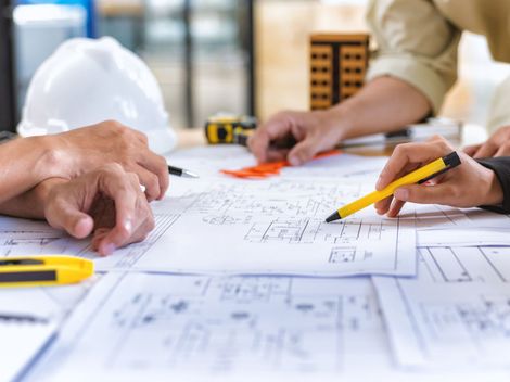 Contractors Checking the Blueprint — Bessemer, AL — Commercial Construction & Maintenance, Inc. Contractors Checking the Blueprint — Bessemer, AL — Commercial Construction & Maintenance, Inc.