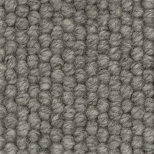 A close up of a gray carpet texture.