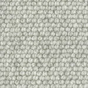 A close up of a white carpet texture.