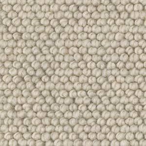 A close up of a white rug with a polka dot pattern.