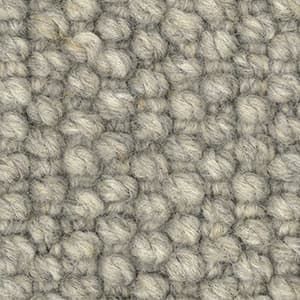 A close up of a gray carpet texture.