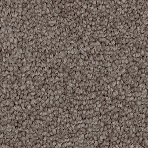 A close up of a carpet with a lot of small stones on it.