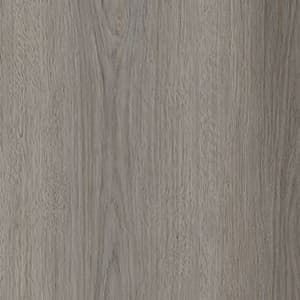 A close up of a gray wood grain texture.