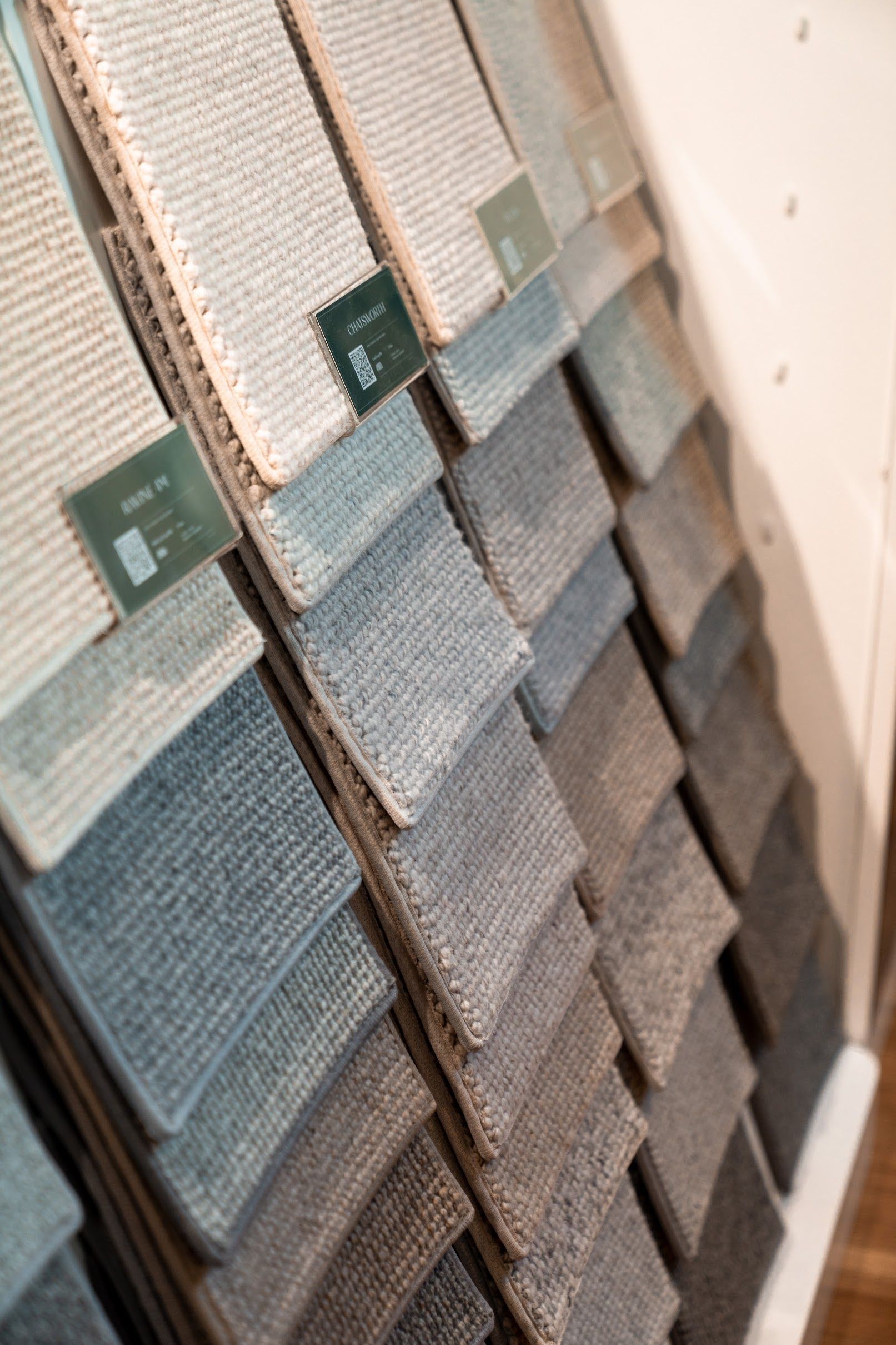 There are many different types of carpets on display in this store.