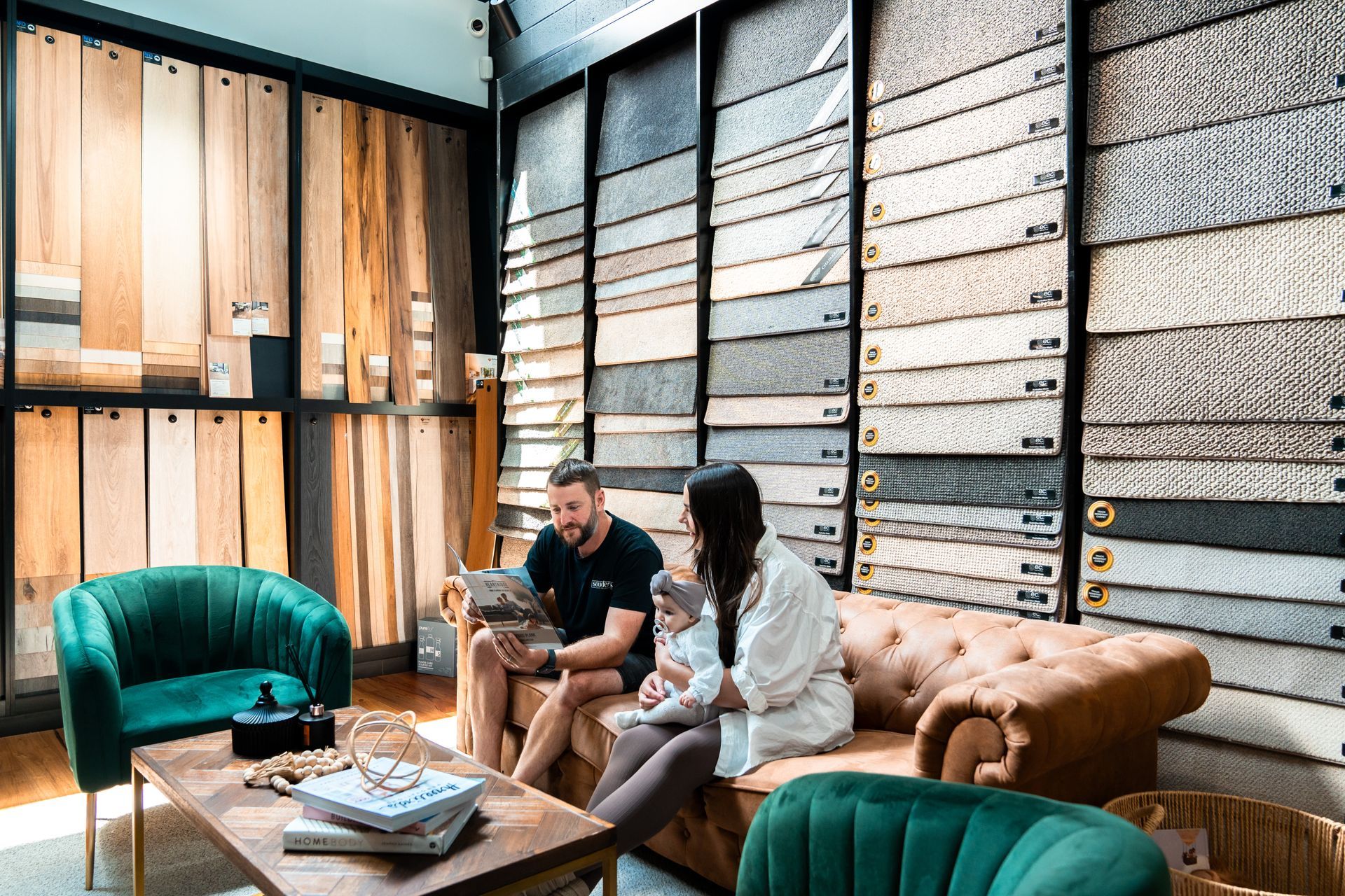 A man and a woman are sitting on a couch in a living room.