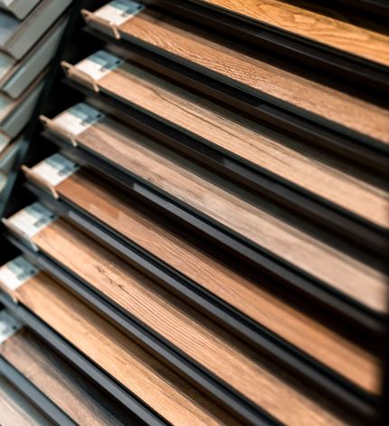 A bunch of wooden boards are stacked on top of each other