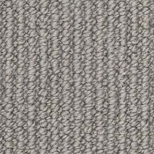 A close up of a gray carpet texture.