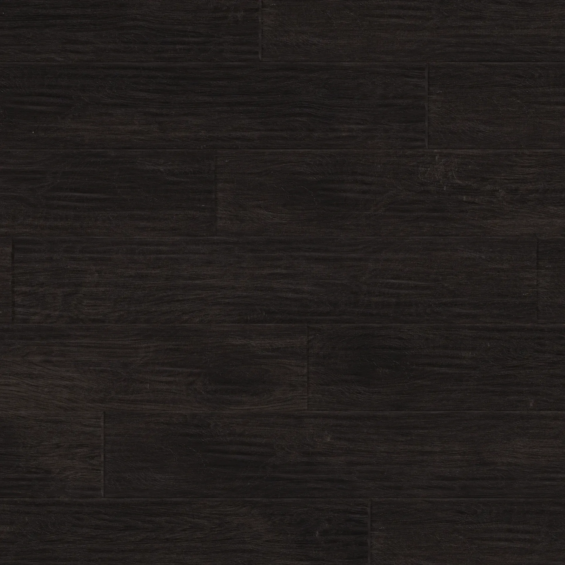 A close up of a black wooden floor.