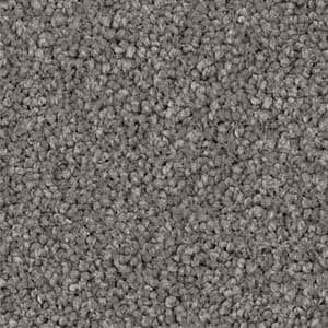 A close up of a gray carpet texture.