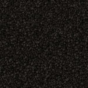 A close up of a black carpet texture.