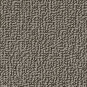A close up of a carpet texture that looks like a maze.